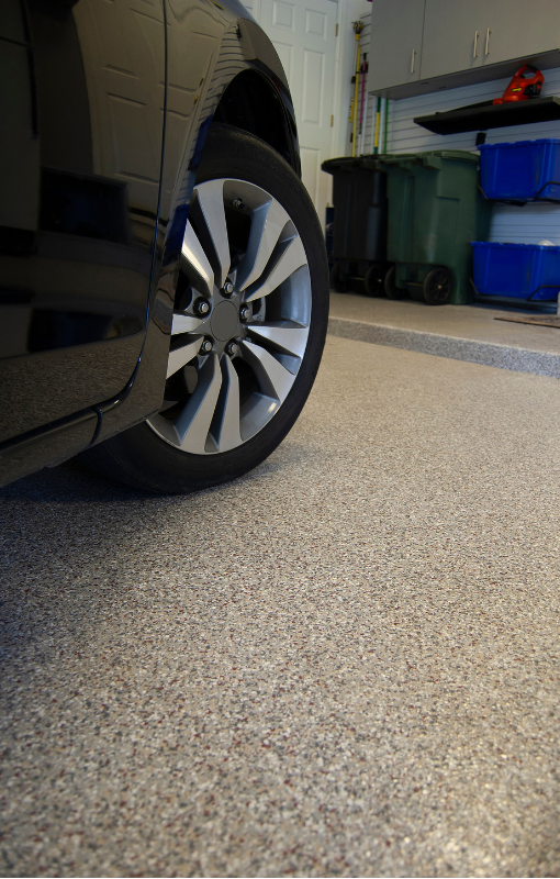 garage flooring epoxy done with black car parked on top in Amarillo Texas